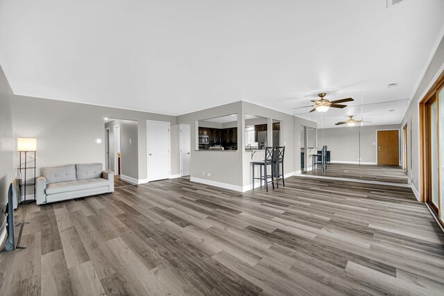 17824 Bernard Dr Unit 3D, Orland Park, IL 60467 - unfurnished living room featuring ceiling fan and wood finished floors