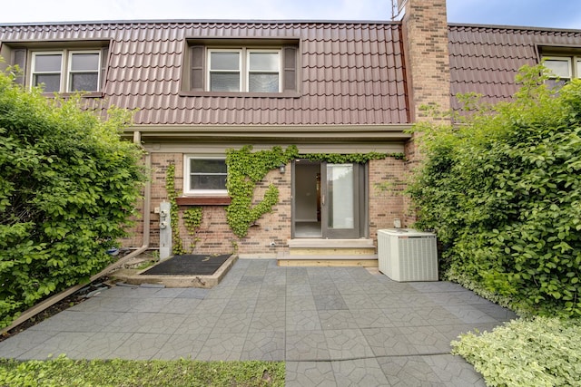 1770 Henley St Unit C, Glenview, IL 60025 - back of house with brick siding, a tiled roof, and mansard roof