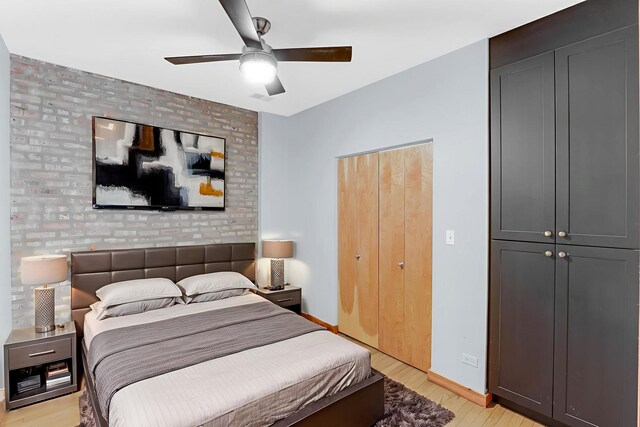 1225 W Greenleaf Ave Unit 3E, Chicago, IL 60626 - bedroom with light wood-style flooring and a ceiling fan