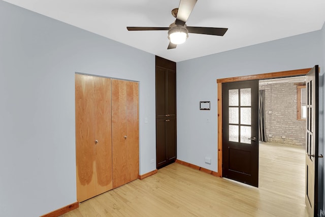 1225 W Greenleaf Ave Unit 3E, Chicago, IL 60626 - unfurnished bedroom featuring light wood-type flooring, a ceiling fan, and a closet