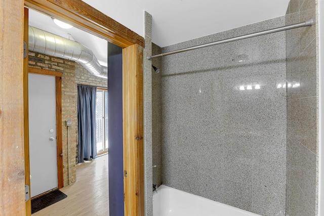 1225 W Greenleaf Ave Unit 3E, Chicago, IL 60626 - bathroom with shower / washtub combination and wood finished floors