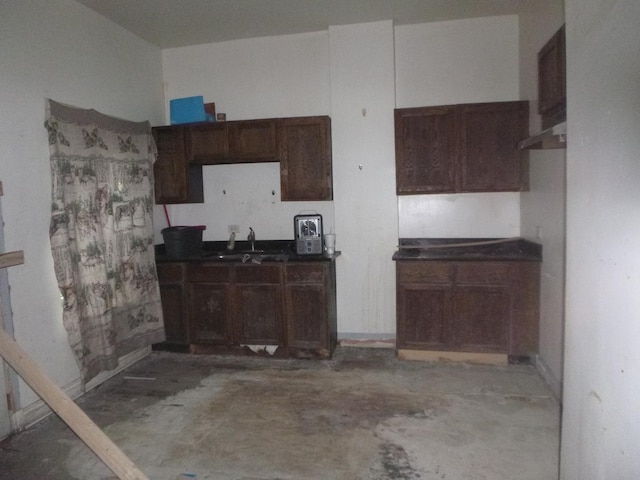 1528 S Spaulding Ave, Chicago, IL 60623 - kitchen with concrete flooring and dark countertops
