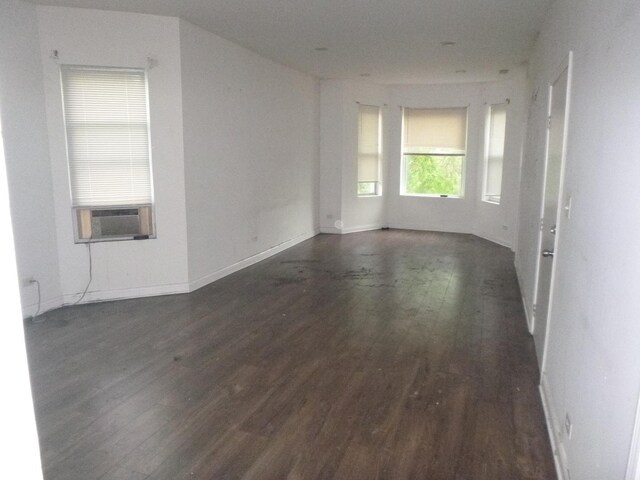1528 S Spaulding Ave, Chicago, IL 60623 - empty room with cooling unit and wood finished floors