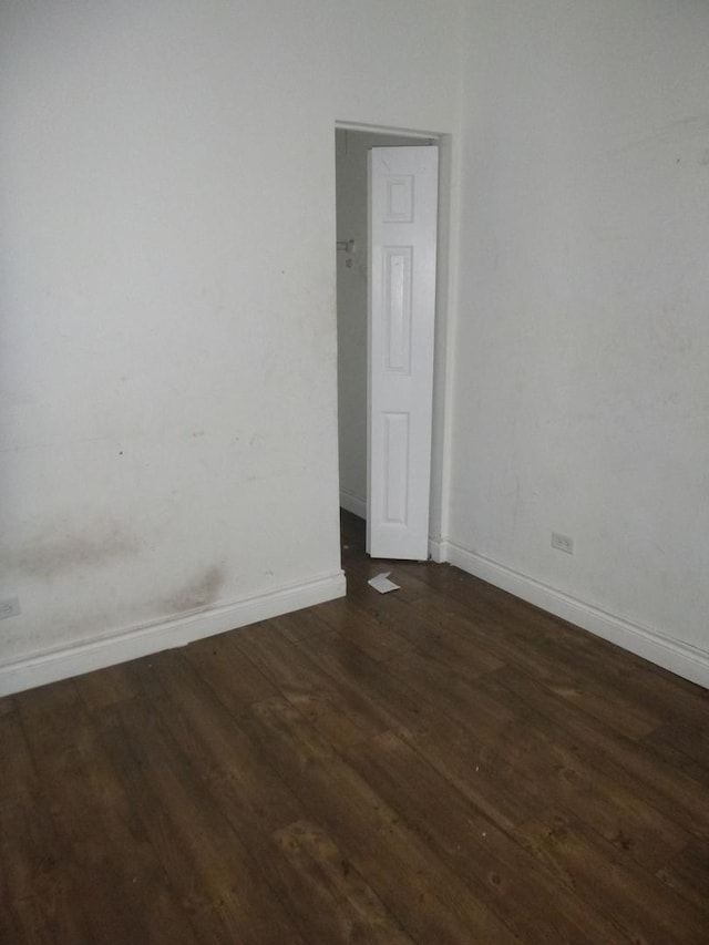 1528 S Spaulding Ave, Chicago, IL 60623 - spare room with dark wood-style floors and baseboards