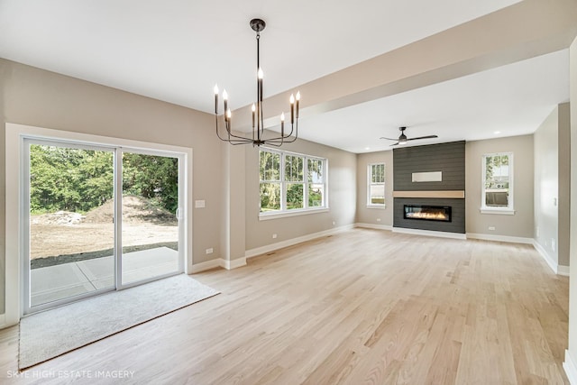 4947 Wilcox Ave, Downers Grove, IL 60515 - unfurnished living room featuring light wood finished floors, a ceiling fan, a chandelier, and a fireplace
