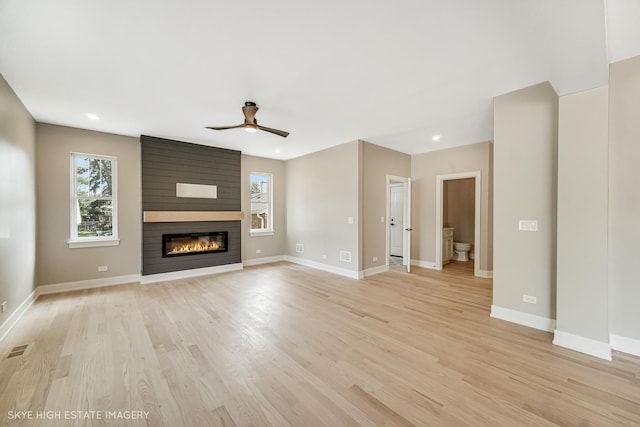 4947 Wilcox Ave, Downers Grove, IL 60515 - unfurnished living room with a ceiling fan, a large fireplace, plenty of natural light, light wood-style flooring, and recessed lighting