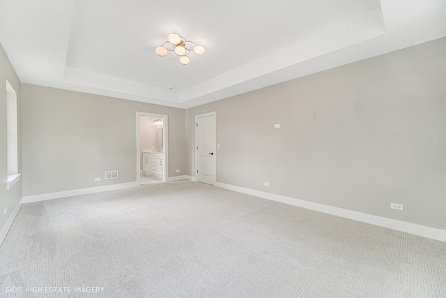 4947 Wilcox Ave, Downers Grove, IL 60515 - unfurnished room featuring a tray ceiling and light carpet