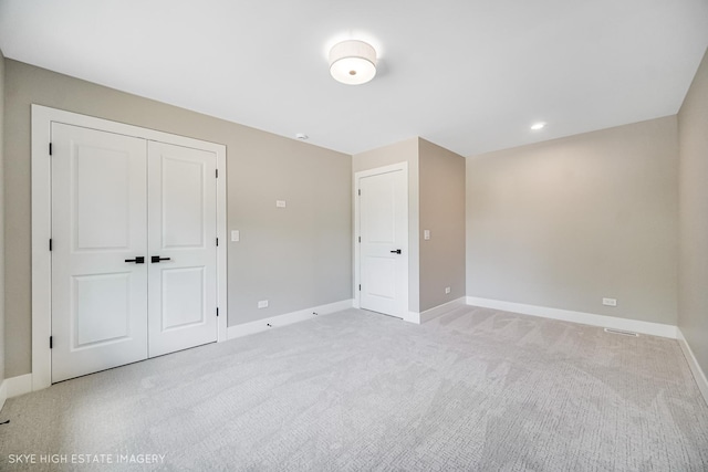 4947 Wilcox Ave, Downers Grove, IL 60515 - unfurnished bedroom with light colored carpet and a closet