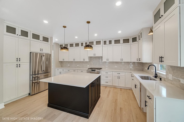 4947 Wilcox Ave, Downers Grove, IL 60515 - kitchen with stainless steel appliances, a center island, light wood-type flooring, light countertops, and recessed lighting