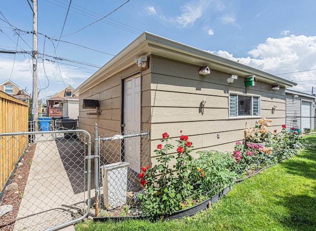 3355 N Neva Ave, Chicago, IL 60634 - view of property exterior with a gate