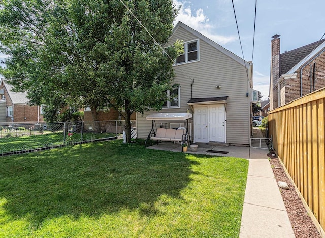 3355 N Neva Ave, Chicago, IL 60634 - rear view of property featuring a fenced backyard