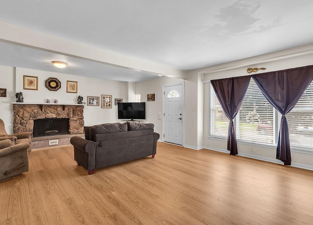 3355 N Neva Ave, Chicago, IL 60634 - living area featuring light wood-type flooring and a fireplace