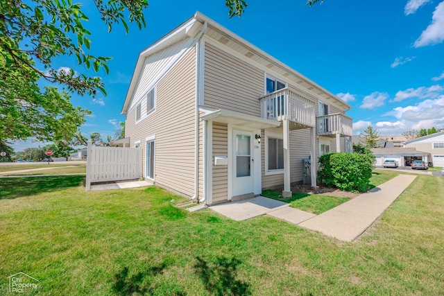 1594 Cornell Cir, Hoffman Estates, IL 60169 - view of front of house with a balcony and a front lawn