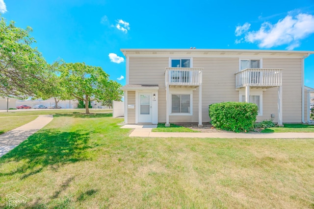 1594 Cornell Cir, Hoffman Estates, IL 60169 - view of front of house with a front lawn and a balcony