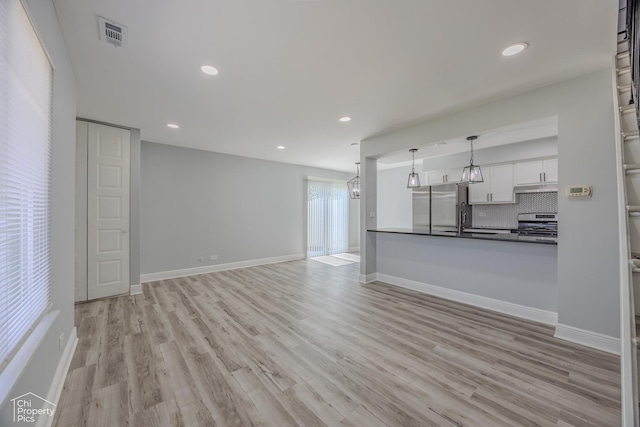 1594 Cornell Cir, Hoffman Estates, IL 60169 - unfurnished living room with light wood finished floors, recessed lighting, and a chandelier