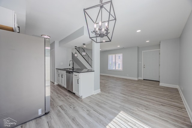 1594 Cornell Cir, Hoffman Estates, IL 60169 - kitchen with stainless steel appliances, dark countertops, white cabinets, light wood finished floors, and recessed lighting