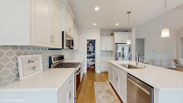 1517 128th St, Lemont, IL 60439 - kitchen with appliances with stainless steel finishes, light wood-style flooring, tasteful backsplash, white cabinets, and recessed lighting
