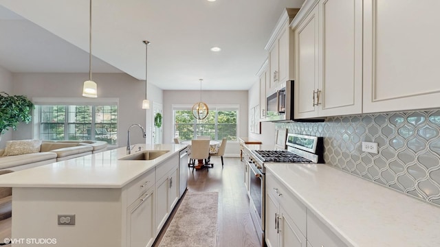1517 128th St, Lemont, IL 60439 - kitchen featuring appliances with stainless steel finishes, light wood-style flooring, backsplash, light countertops, and white cabinets