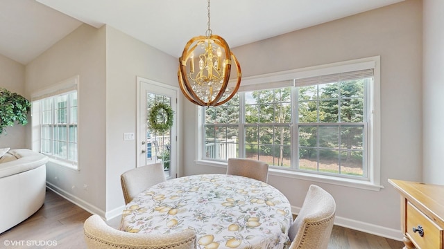 1517 128th St, Lemont, IL 60439 - dining space featuring wood finished floors and a chandelier