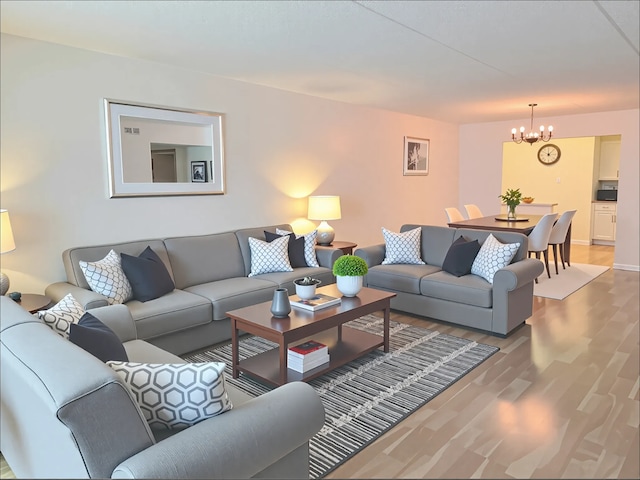9386 Landings Ln Unit 306, Des Plaines, IL 60016 - living room featuring a chandelier and light wood finished floors