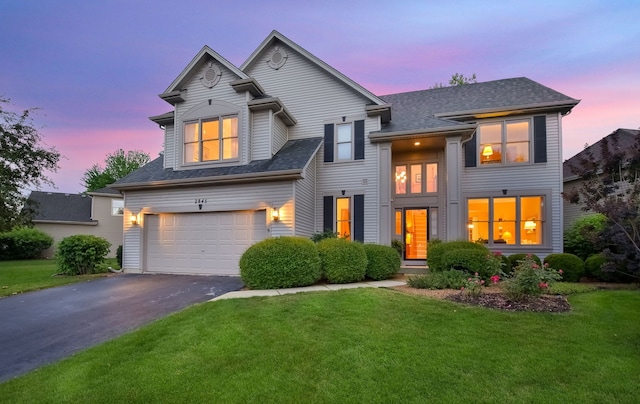 2845 Kendridge Ln, Aurora, IL 60502 - view of front of house featuring a garage, asphalt driveway, a yard, and a shingled roof