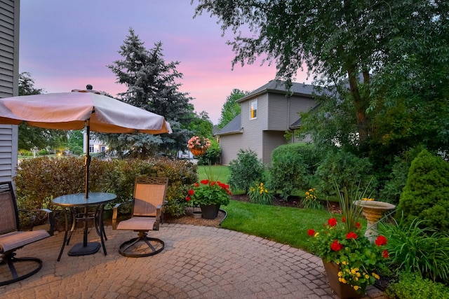 2845 Kendridge Ln, Aurora, IL 60502 - patio terrace at dusk with a patio area and a yard
