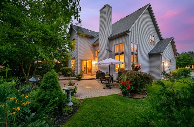 2845 Kendridge Ln, Aurora, IL 60502 - back of house with a patio, a chimney, a lawn, and roof with shingles