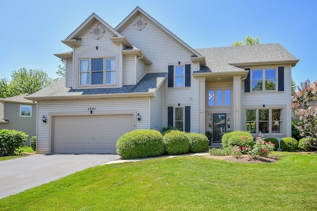 2845 Kendridge Ln, Aurora, IL 60502 - view of front of house with an attached garage, a front lawn, driveway, and roof with shingles