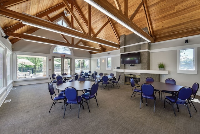 2845 Kendridge Ln, Aurora, IL 60502 - carpeted dining room with a wood ceiling with exposed beams, high vaulted ceiling, and a glass covered fireplace