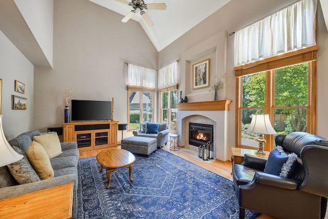 2845 Kendridge Ln, Aurora, IL 60502 - living room with high vaulted ceiling, ceiling fan, a fireplace with flush hearth, wood finished floors, and healthy amount of natural light