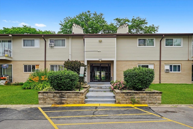 860 E Old Willow Rd Unit 228, Prospect Heights, IL 60070 - view of property featuring uncovered parking