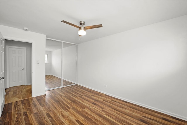 860 E Old Willow Rd Unit 228, Prospect Heights, IL 60070 - unfurnished bedroom featuring a closet, dark wood-style flooring, and ceiling fan