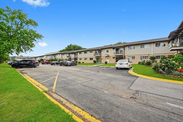 860 E Old Willow Rd Unit 228, Prospect Heights, IL 60070 - uncovered parking lot featuring a residential view