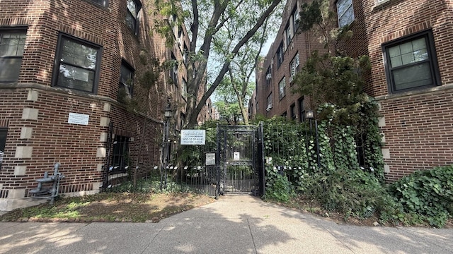 5455 S Ingleside Ave Unit 3E, Chicago, IL 60615 - view of side of property with a gate and brick siding