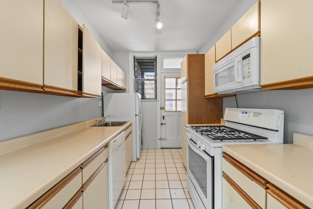 5455 S Ingleside Ave Unit 3E, Chicago, IL 60615 - kitchen featuring white appliances, light countertops, light tile patterned floors, and rail lighting