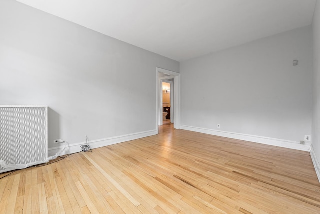 5455 S Ingleside Ave Unit 3E, Chicago, IL 60615 - spare room featuring wood-type flooring and baseboards