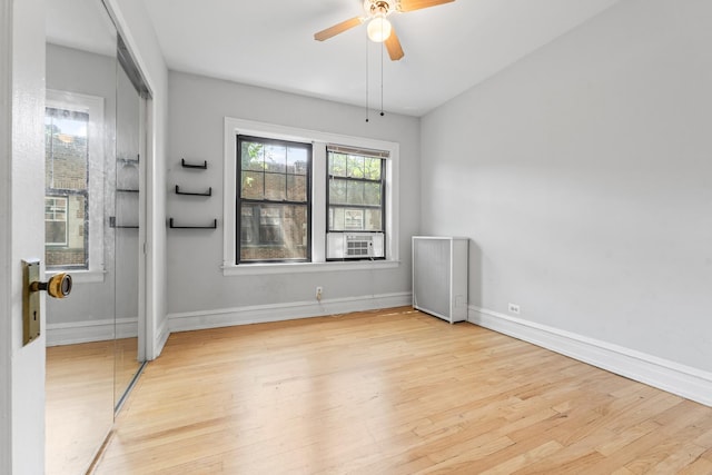 5455 S Ingleside Ave Unit 3E, Chicago, IL 60615 - empty room with wood finished floors, a ceiling fan, and cooling unit