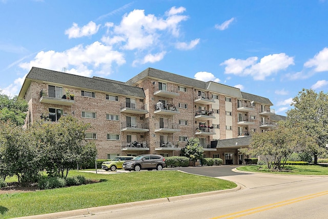1000 S Lorraine Rd Unit 110, Wheaton, IL 60189 - view of apartment building / complex featuring uncovered parking