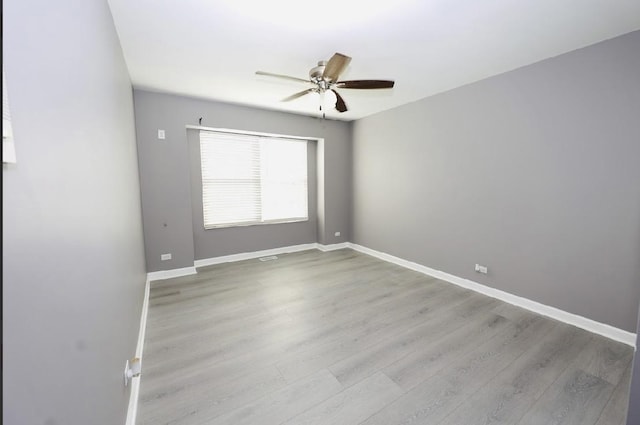 spare room featuring ceiling fan and wood finished floors
