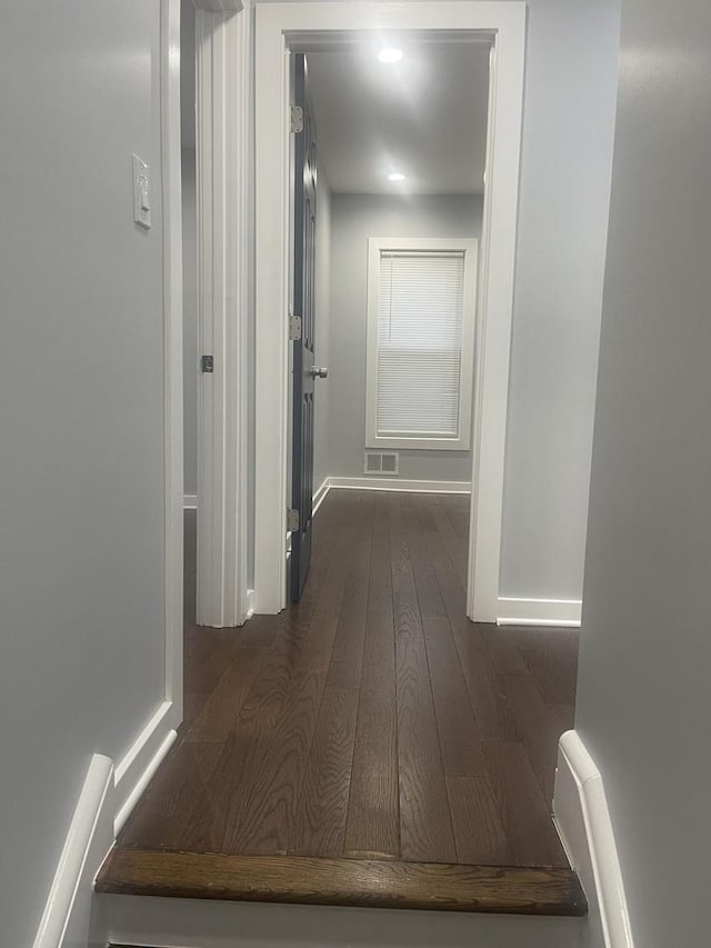 48 E 154th St, Harvey, IL 60426 - corridor featuring dark wood-style floors and baseboards