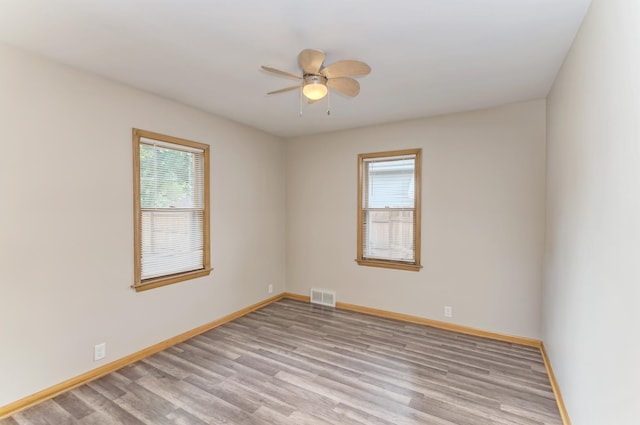 1617 Oakland Ave, Crest Hill, IL 60403 - unfurnished room featuring ceiling fan and wood finished floors