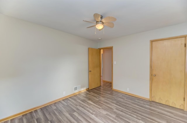 1617 Oakland Ave, Crest Hill, IL 60403 - unfurnished bedroom featuring wood finished floors and ceiling fan