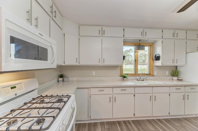 1617 Oakland Ave, Crest Hill, IL 60403 - kitchen featuring white appliances, light countertops, white cabinetry, and light wood-type flooring