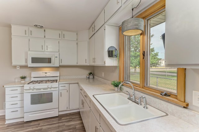 1617 Oakland Ave, Crest Hill, IL 60403 - kitchen featuring white appliances, light countertops, white cabinets, and dark wood finished floors
