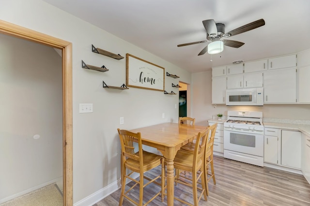 1617 Oakland Ave, Crest Hill, IL 60403 - kitchen featuring white appliances, light countertops, white cabinets, and ceiling fan