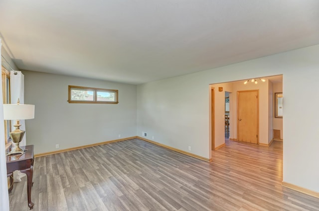 1617 Oakland Ave, Crest Hill, IL 60403 - empty room featuring light wood-style floors and baseboards