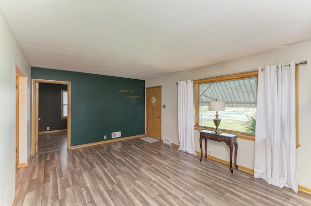 1617 Oakland Ave, Crest Hill, IL 60403 - spare room featuring wood finished floors and healthy amount of natural light