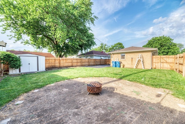 1617 Oakland Ave, Crest Hill, IL 60403 - fenced backyard featuring a fire pit, a storage unit, and a patio area