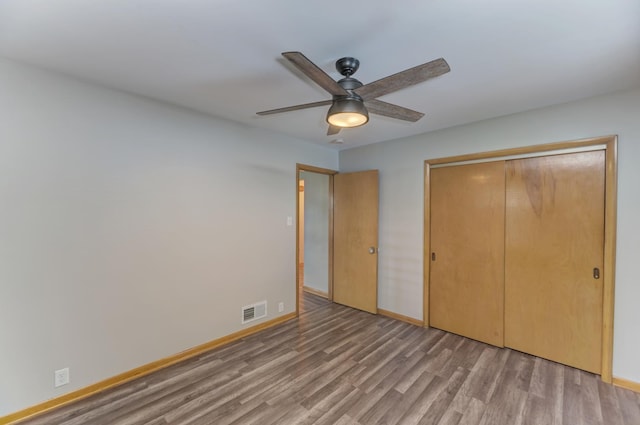1617 Oakland Ave, Crest Hill, IL 60403 - unfurnished bedroom featuring light wood-style floors, a closet, and a ceiling fan