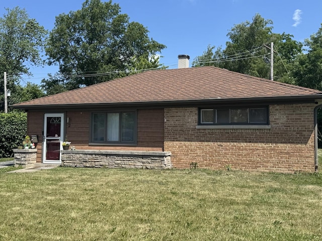 2 Sauk Trl, Park Forest, IL 60466 - view of front of home with a chimney, brick siding, and a front lawn